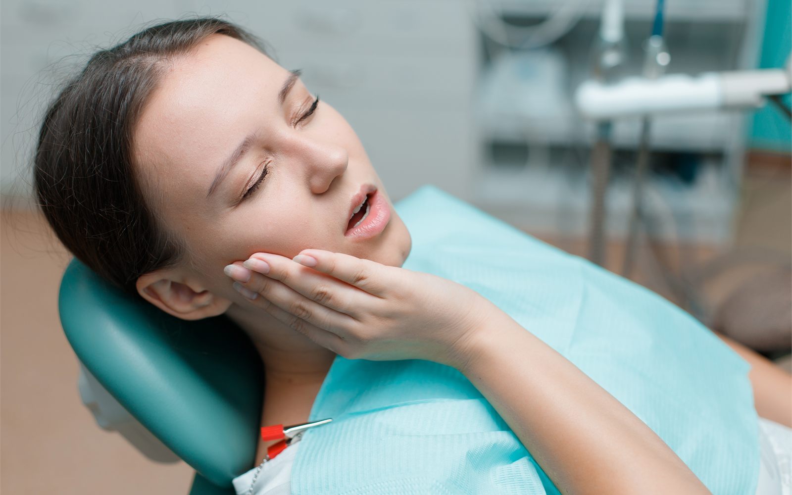 Young woman having a tooth-colored filling placed at a Fresno, CA dental office