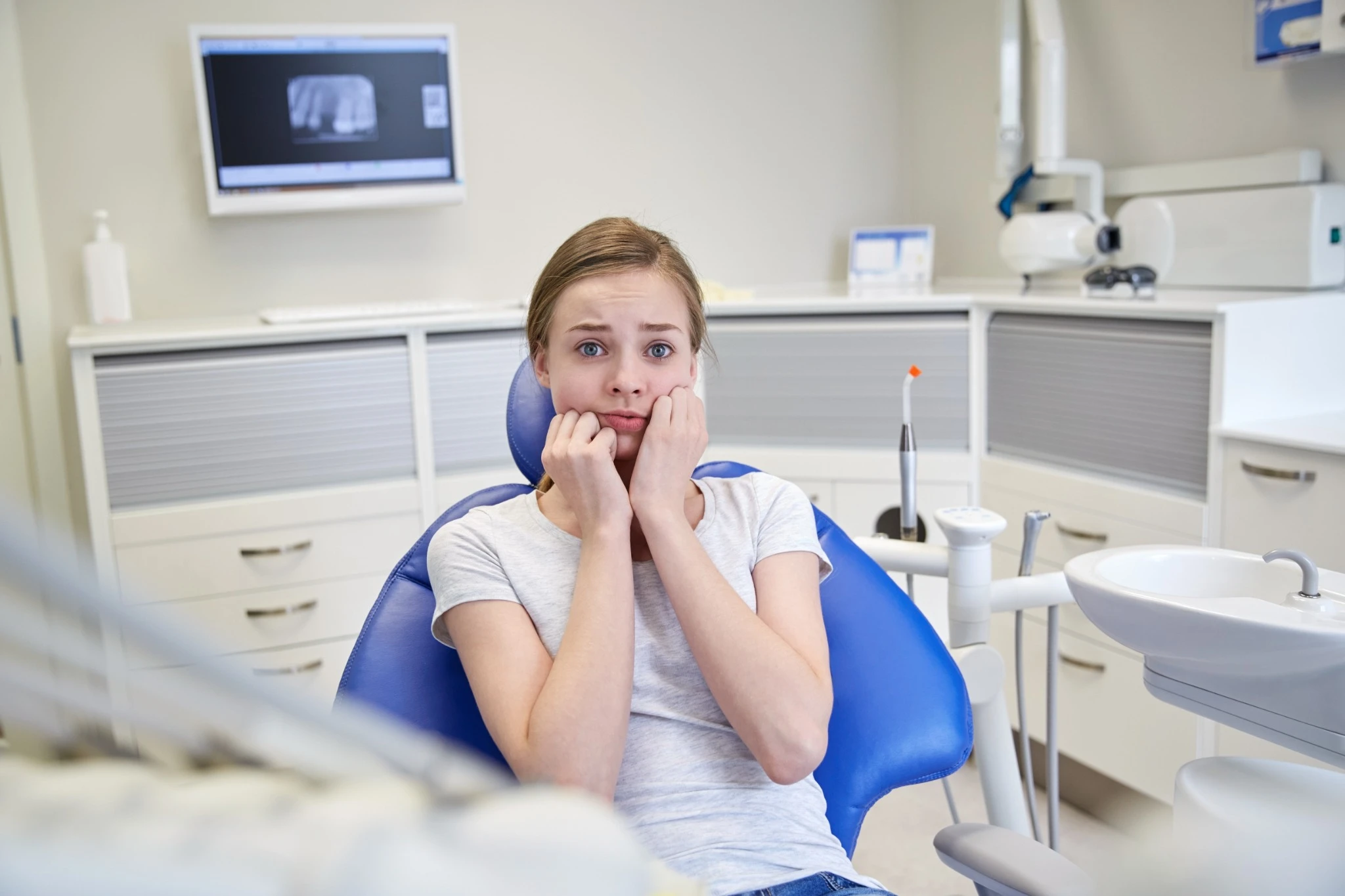 Nervous patient waiting for emergency dental treatment