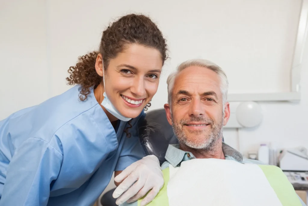 Happy dental patient smiling after treatment