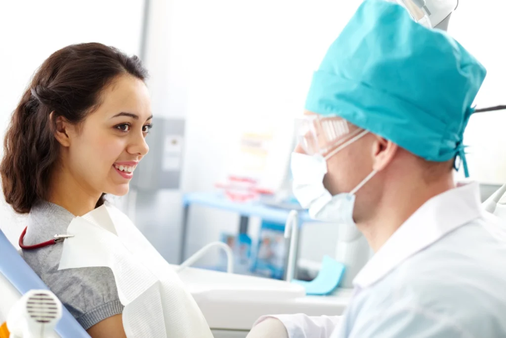 Patient smiling in dental chair after cleaning