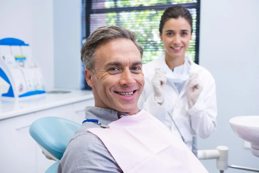 Male patient smiling during dental appointment